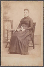 Seated woman holding book studio cabinet by S S Dengler: Slatington PA picture