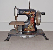 Early 1900’s Casige full body  Toy Sewing Machine Cinderella Fairy Tale decal picture