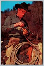 Postcard Western Cowboy Reloads His Revolver Gun picture