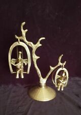 Brass Elephants Swinging on a Tree in Egg Chairs Reading Books picture