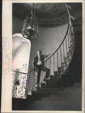1963 Press Photo Harold Lloyd on his oak with a wrought iron rail staircase picture