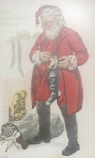 Postcard Santa Claus Near Fireplace Chimney Stuffing Stocking full of toys 1916 picture