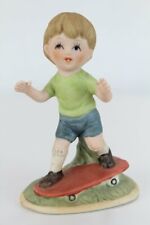 Little Boy on Skateboard porcelain Figurine 3 1/2