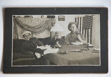 Vtg Photograph c. 1910s Mens Cleaning Pistols Guns US Flag Behind Wild West picture