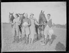 Three polo players and an unidentified woman standing with their p - Old Photo picture