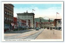 c1930's Pike's Peak Avenue Building Cars Stores Colorado Spring CO Postcard picture