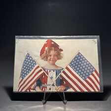 Vintage Postcard Girl With Flags And Patriotic Dress And Hat picture