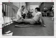 1976 Press Photo Dr. Kenneth Cooper works with athlete. - hpa54638 picture