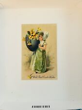 Easter Postcard Girl in Bonnet Carries Big Blue Egg Filled with Primroses picture