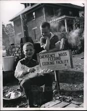1955 Press Photo Children enjoys emergency mass meal of Red Cross picture