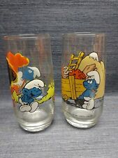Two 1982 Smurf Collectible Glasses by Wallace Berrie & Co. Hardees Hefty & Jokey picture