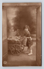 c1921 RPPC Studio Portrait of Young Girl & Flower Cart Real Photo Postcard picture