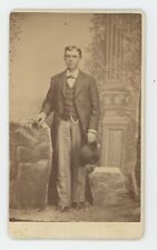 Antique CDV Circa 1870s Handsome Young Man Long Coat Holding Hat Lexington, MO picture