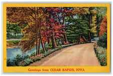 c1940's River Car Passing Greetings from Cedar Rapids IA Vintage Postcard picture