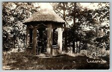 Centerville MA? OH? IA? RPPC~Man Sits in Grass Roof, Log Gazebo~Cosy Corner~1910 picture
