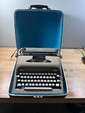1955 royal heritage typewriter.Great condtion, with case, gray color, white keys picture