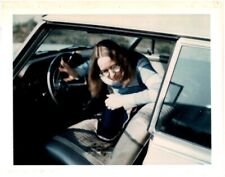 Young Woman in Glasses Climbing Through Front Seat of Car 1970s Vintage Photo picture