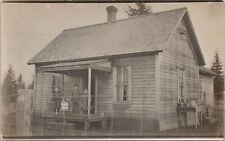RPPC Poverty Scene Four Children Posing on Small Wooden House Porch early 1900s picture