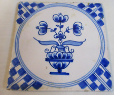 ANTIQUE DELFT (HB) TIN GLAZED TILE WITH GEOMETRIC CORNERS AND A VASE OF FLOWERS picture