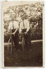 Two men with early bicycles, c. 1905, bikes, real photo postcard RPPC, old picture