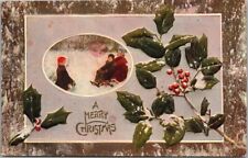 c1910s MERRY CHRISTMAS Embossed Postcard Kids Playing Snow / Holly - UNUSED picture