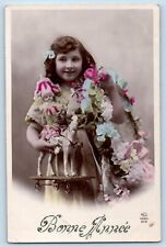 New Year Postcard RPPC Photo Bonne Annee Pretty Little Girl With Toy Flowers picture