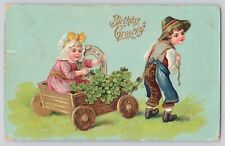 Postcard Birthday Greetings Boy & Girl In Cart With Horseshoe 4 Leaf Clover 1912 picture