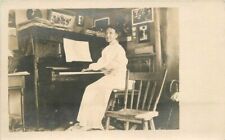 C-1910 Interior woman playing piano music RPPC Photo Postcard 20-5649 picture