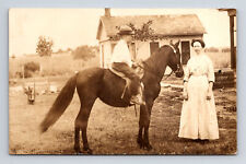 RPPC Mother & Young Boy Son on Small Horse Country Homestead Real Photo Postcard picture