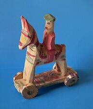 Vintage Peru Folk Art hand carved & Painted wood donkey With rider & Wheels picture