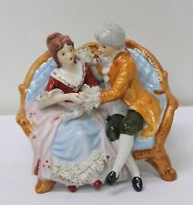 Vintage Ceramic Figurine Victorian Couple Sitting on a Couch picture