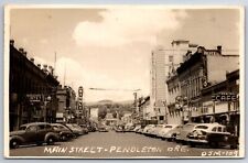 Pendleton Oregon~Main Street~Rivoli Theatre~Terminal Cafe~Temple Hotel~1949 RPPC picture