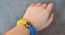 Paracord bracelet with the coat of arms of Ukraine with a flag picture