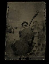 creepy unusual tintype clown mask or puppet and cello abstract photo 1800s picture