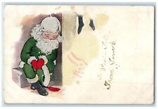 1911 Christmas Santa Claus Green Robe Hanging Stocking Norcatur KS Postcard picture
