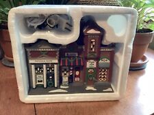 Dept 56 Christmas in the City - Riverside Row Shops In Foam Sleeve. Nice picture