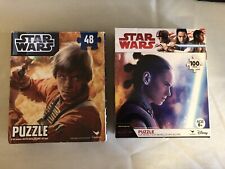 2 Star Wars puzzles 9.125 x 10.375 in. 48 & 100 pc.100 pc bag is sealed. All pcs picture
