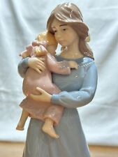 Mother holding child / little girl 11” porcelain figurine. picture