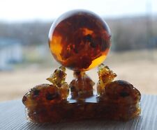 Three Baltic Amber Dragons figurine holding Amber Ball with inclusion Bee picture