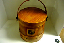 An antique wooden barrel shaped sewing basket picture