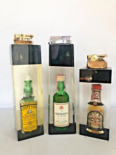 Three Vintage Mid Century Modern Lucite Cigarettes' Lighters picture