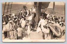 RPPC Navy Sailors Aboard Ship, Man Holds Dog RARE ANTIQUE Postcard AZO 1904-18 picture