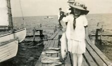 G809 Original Vintage Photo EDWARDIAN GIRL HOLDING A FISH, BOATS DOCK c 1900's picture