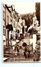 High Street Clovelly England Man and Two Pack Mules Donkeys RPPC Postcard F1 picture