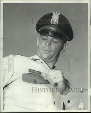 1962 Press Photo Houston Patrolman Phillip Camus shows new type of HPD name tag picture