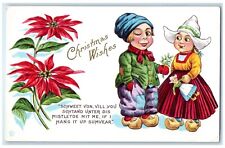 c1910's Christmas Wishes Dutch Kids Poinsettia Flowers Embossed Antique Postcard picture
