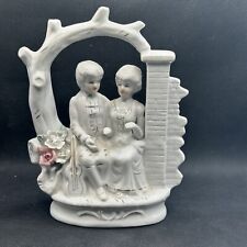 Vintage Victorian Couple Sitting in An Arched Porcelain Bench with Flowers & Tri picture