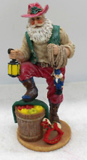 Vintage Christmas Cowboy Santa 9. in.with lantern and boot on an barel. picture