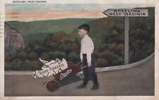 Vintage 1933 Postcard- Boy pushing a wheelbarrow, Wheeling, WV White Border picture