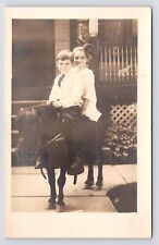 c1908 Happy Boy & Girl Riding Pony in front of House Porch Candid RPPC Postcard picture